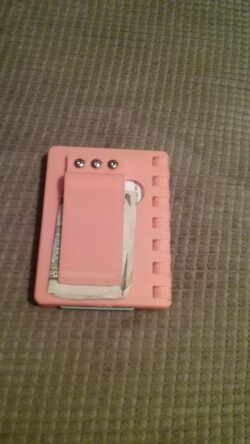 An early PLA print — a functional hinged wallet that I carried daily for over a year.