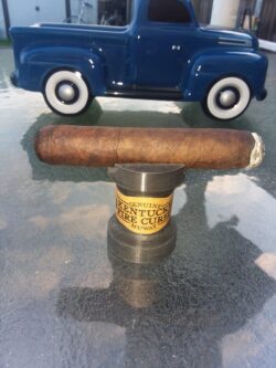 3D printed cigar stand featuring a Kentucky Fire Cured Genuine MUWAT cigar — because sometimes your hobby needs a hobby.