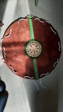 Commissioned hobo-style carry bag made from 8oz buffalo hide with hand-dyed veg-tan accents, cotton rope draw strap, and custom laser-engraved artwork.