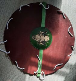 Commissioned hobo-style carry bag made from 8oz buffalo hide with hand-dyed veg-tan accents, cotton rope draw strap, and custom laser-engraved artwork.