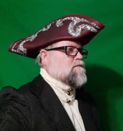 Handcrafted tricorn hat made from Volcano pull-up leather in Black Cherry, finished with a bold contrasting trim.