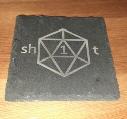 Laser engraved slate coaster with a D20 design and a tabletop-gamer phrase we all know too well.