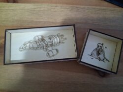 A set of laser-cut birch plywood valet trays, engraved with two iconic characters — both of whom aim to misbehave.